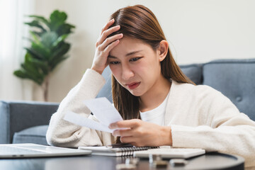 Stressed bankrupt financial crisis concept, Young adult in nervous after calculated loan expense...
