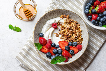 Granola bowl with greek yogurt and fresh berries