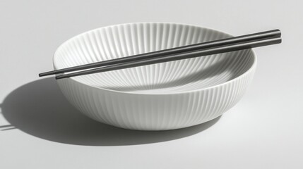 White ribbed bowl with chopsticks