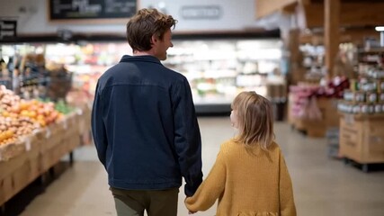 Father & daughter shopping together in a grocery store, family bonding during everyday tasks, exploring produce while building family connections a parent guiding child's shopping experience - Powered by Adobe