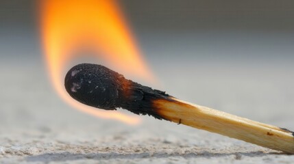 Close-up of a burning match.