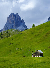 Hut in Passo Giau and mountain of Averau, hiking in the Alta via 1, in the Dolomites of Italy.