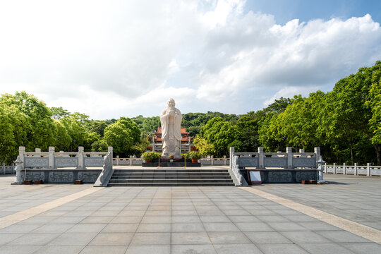 The Plaza in Front of the Confucius Statue on a Serene Day with Lush Greenery and Clear Skies