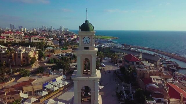 Aerial Orbit around the clock tower of St. Peter's church in Jaffa Israel