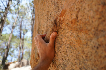 Hand on Sharp Granite Boulder in Sintra Forest for Sport Bouldering