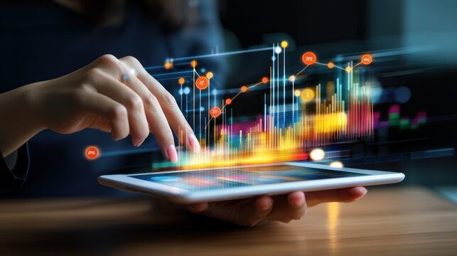 Woman using tablet with financial data charts