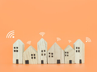 Miniature house with Wifi signal. The concept of network connect, internet of things, smart home control and automation system technology