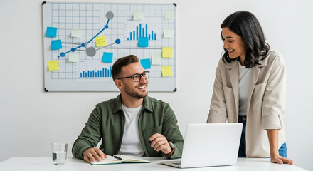 Colleagues collaborating on a project with a whiteboard presentation