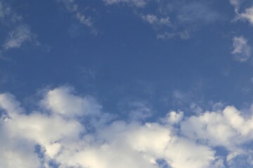 Contrasting blues meet fluffy whites in a serene skyscape perfect for adding an open and airy