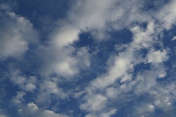 Serene Sky Canvas Cumulus Clouds Drifting across Azure Expanse Soft Light Atmosphere