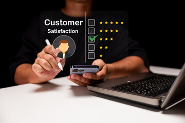 A person rates customer satisfaction on a digital interface using a smartphone and laptop, highlighting a four-star review on a transparent screen.