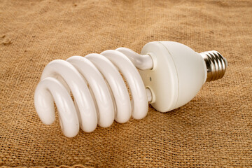 One LED lamp on jute cloth, macro.