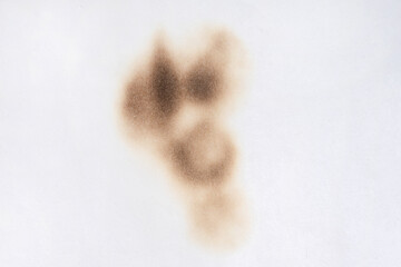 Paper burn black  stain. Round paper burn mark close up. burns borders paper close up