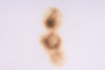 Paper burn black  stain. Round paper burn mark close up. burns borders paper close up