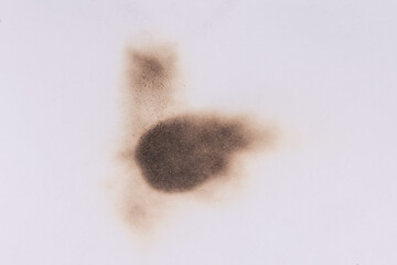 Paper burn black  stain. Round paper burn mark close up. burns borders paper close up