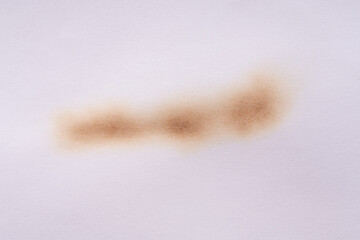 Paper burn black  stain. Round paper burn mark close up. burns borders paper close up