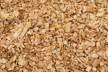 Wooden chips texture background close up. small wood chips for smoking top view. sawdust texture. ecological fuel