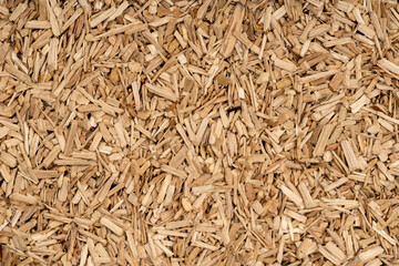 Wooden chips texture background close up. small wood chips for smoking top view. sawdust texture. ecological fuel