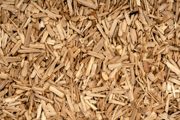 Wooden chips texture background close up. small wood chips for smoking top view. sawdust texture. ecological fuel