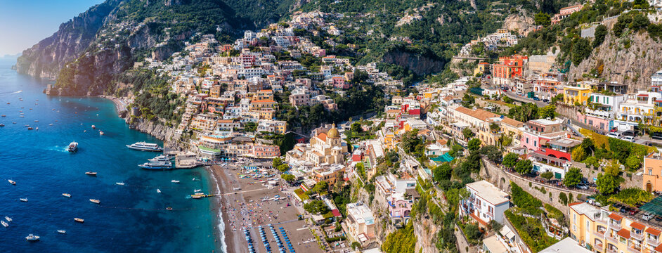 Aerial view of Positano with comfortable beach and blue sea on Amalfi Coast in Campania, Italy. Positano village on the Amalfi Coast, Salerno, Campania. Beautiful Positano, Amalfi Coast in Campania.