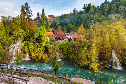 Village of Rastoke near Slunj in Croatia, old water mills on waterfalls of Korana river, beautiful countryside landscape. Landscape with river and little waterfalls in Rastoke village, Croatia.