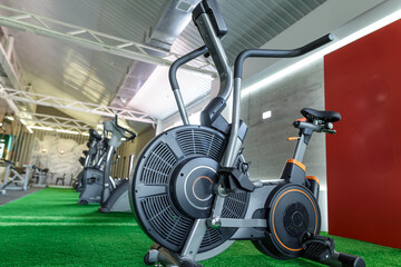 Modern Exercise Bike in Gym Cardio Fitness Equipment for Indoor Training and Healthy Lifestyle