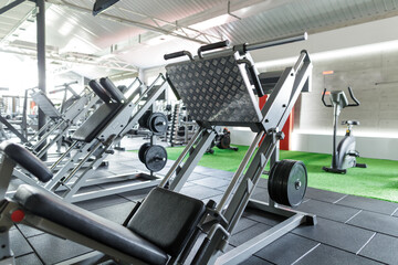 Modern Gym Interior with Leg Press Machine and Strength Equipment for Fitness and Bodybuilding