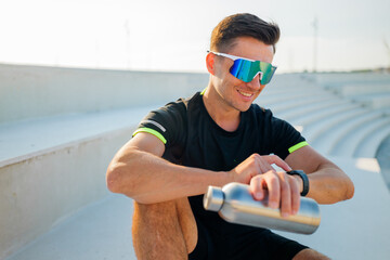 Enjoying a refreshing drink after an intense workout at the stadium