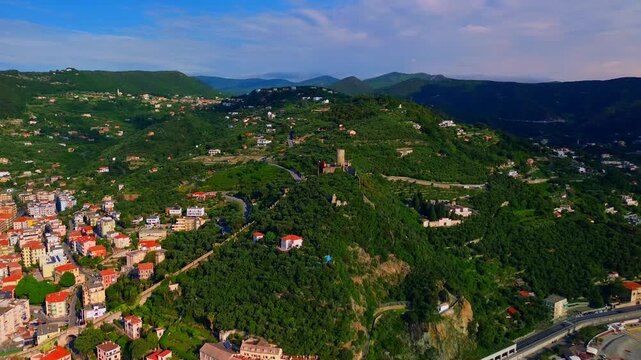 Aerial view of the ruins of an ancient castle, a medieval village on a hill near the Neva River valley and built for defensive purposes, history. Castelvecchio di Rocca Barbena Savona Italy 01.09.2025