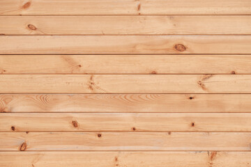 Obraz premium A wooden background with a few small wooden pieces