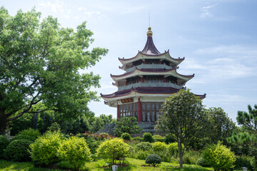 Fototapeta premium Ancient Pagoda and Lush Trees Create a Scenic View