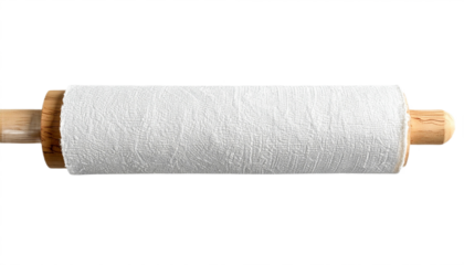 Rolling pin with white textured dough ready for baking pies or cookies at the bakery