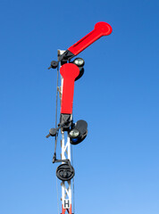Railway semaphore against blue sky