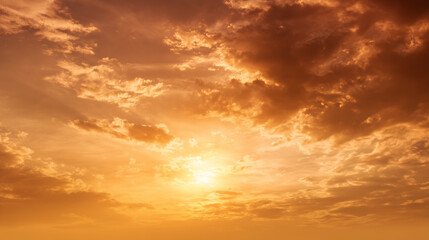 Obraz premium Golden yellow sky glowing with warm light. Beautiful natural scene perfect for backgrounds, sunsets, weather concepts, or serene atmospheric visuals.