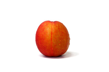 One peach on a white background bowl