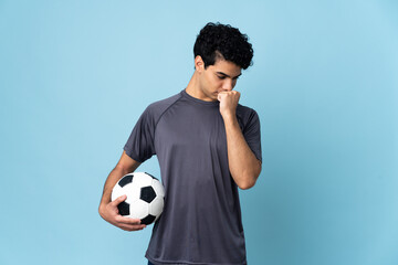 Venezuelan football player man over isolated background having doubts