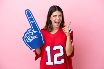 Young Italian fan woman with foam hand isolated on pink background intending to realizes the solution while lifting a finger up