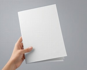 Obraz premium A4 brochure mockup showing one page curled as if turning, floating on a light grey seamless background. Great template or flyer, leaflet, psd design mock-up for creative projects.