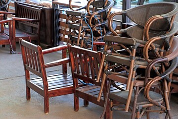 Chairs stacked on top of each other on the restaurant's open veranda