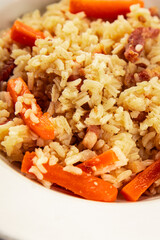 Rice meat and vegetables pilaf fresh delicious gourmet food background on the table rustic food top view copy space