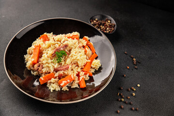 Rice meat and vegetables pilaf fresh delicious gourmet food background on the table rustic food top view copy space