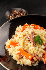 Rice meat and vegetables pilaf fresh delicious gourmet food background on the table rustic food top view copy space