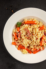 Rice meat and vegetables pilaf fresh delicious gourmet food background on the table rustic food top view copy space