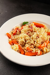 Rice meat and vegetables pilaf fresh delicious gourmet food background on the table rustic food top view copy space