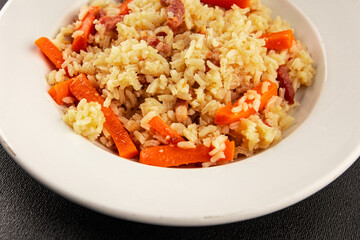 Rice meat and vegetables pilaf fresh delicious gourmet food background on the table rustic food top view copy space