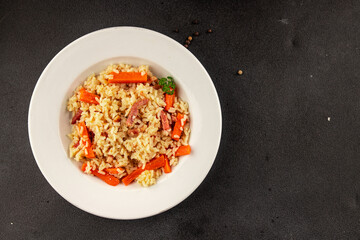 Rice meat and vegetables pilaf fresh delicious gourmet food background on the table rustic food top view copy space