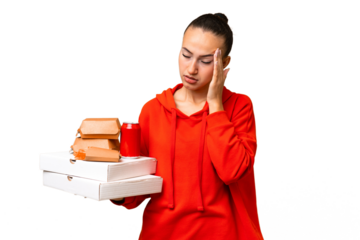 Young Arab woman holding fast food over isolated background with headache
