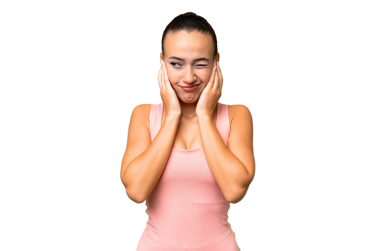 Young Arab woman over isolated background frustrated and covering ears