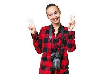 Young photographer Arab woman over isolated background showing victory sign with both hands