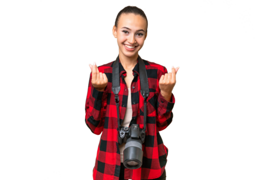 Young photographer Arab woman over isolated background making money gesture